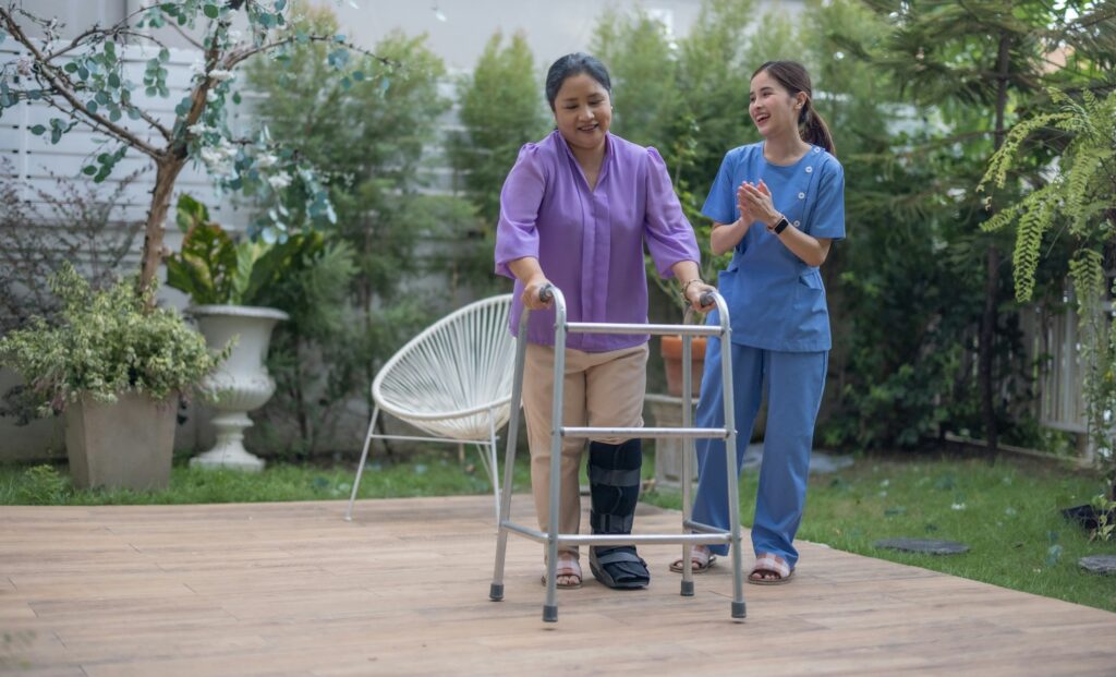 Caregiver Assisting Patient with Walking Exercise